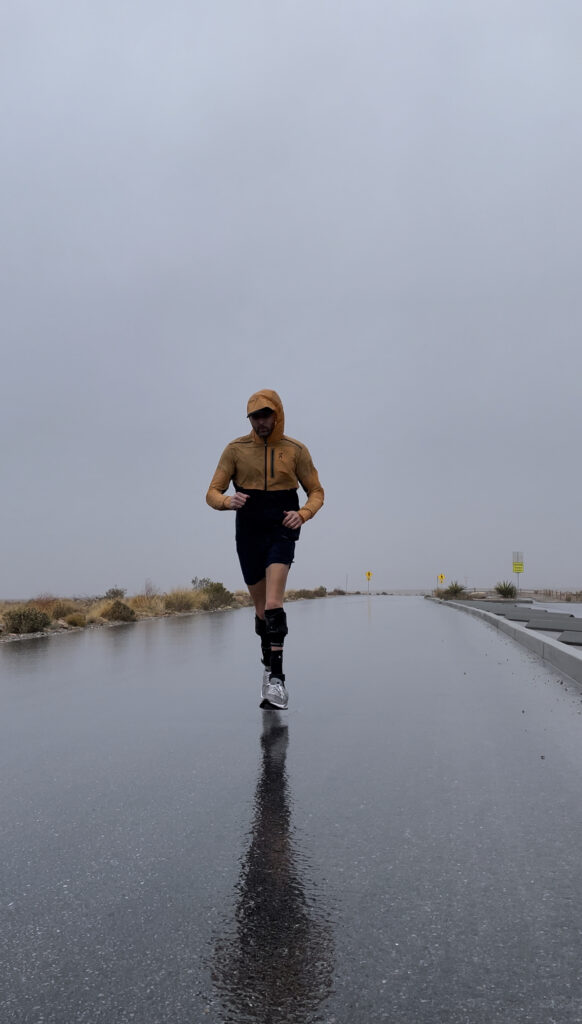 Scott running in a storm