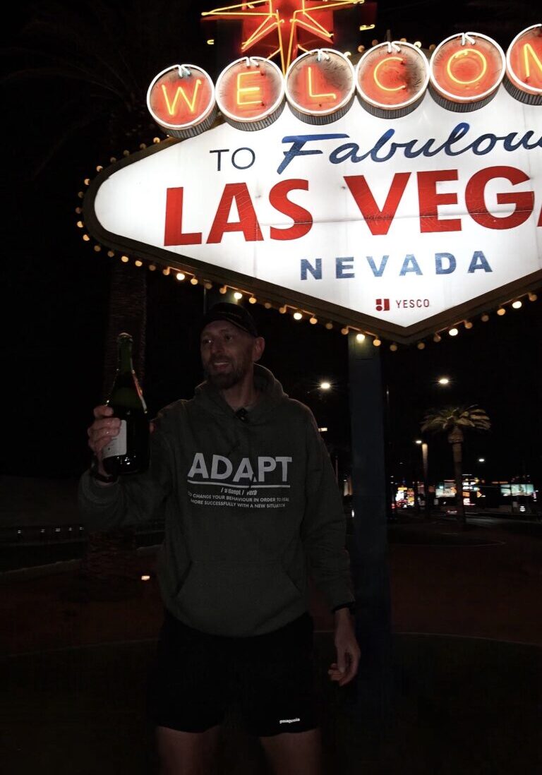 Scott Davidson celebrating 100 mile finish
